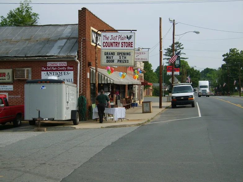 Local storefronts along a Walnut Cove street