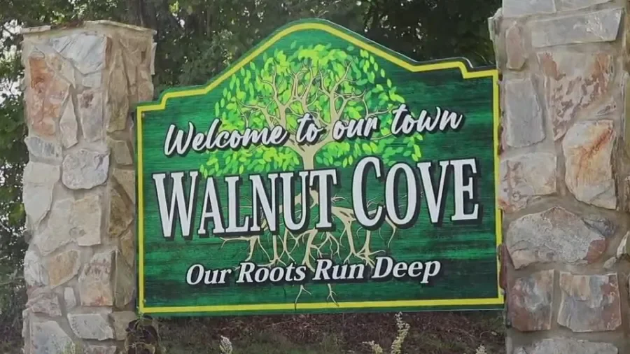 Welcome to Walnut Cove sign between stone pillars